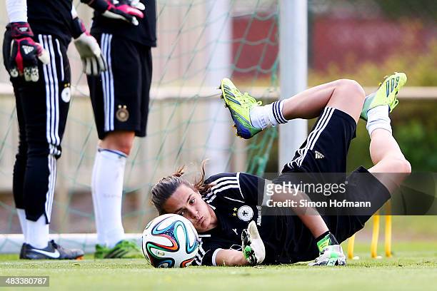 Goalkeeper Nadine Angerer makes a save during a Germany Women's Training Session at SC Kaefertal Training Ground on April 8, 2014 in Mannheim,...