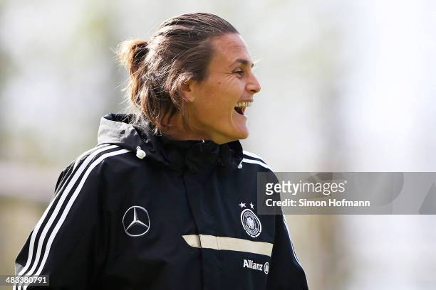 Goalkeeper Nadine Angerer smiles during a Germany Women's Training Session at SC Kaefertal Training Ground on April 8, 2014 in Mannheim, Germany.