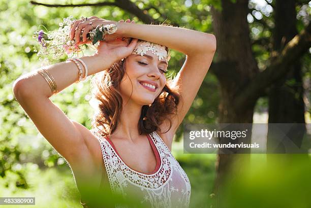 serene boho girl looking relaxed in a summer park - bobo stock pictures, royalty-free photos & images