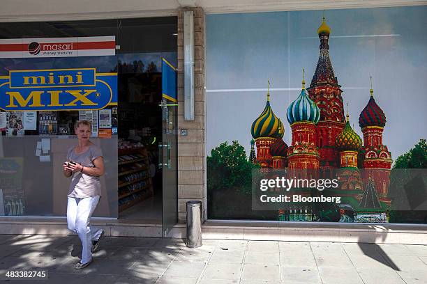 Customer exits a Russian mini supermarket store in Limassol, Cyprus, on Tuesday, April 8, 2014. Cyprus is the biggest foreign investor in Russia with...