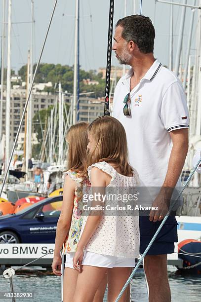 King Felipe VI of Spain and his daugthers Princess Leonor of Spain and Princess Sofia of Spain visit the Aifos boat during the last day of 34th Copa...
