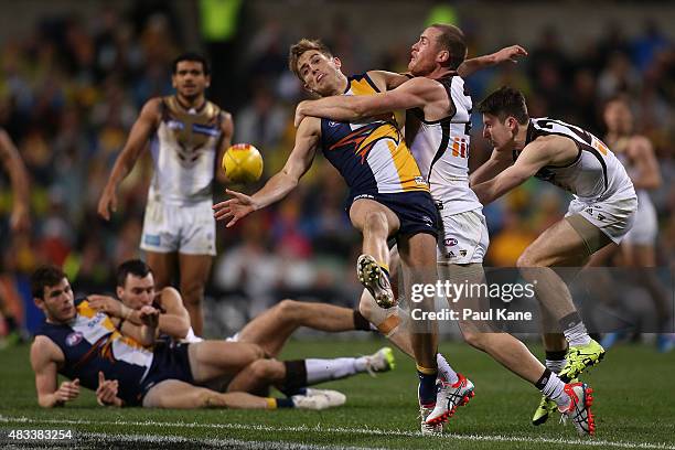 Jarryd Roughead of the Hawks tackles Brad Sheppard of the Eagles during the round 19 AFL match between the West Coast Eagles and the Hawthorn Hawks...