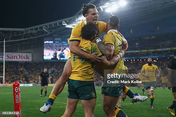 Adam Ashley-Cooper, Matt Toomua and Israel Folau of the Wallabies celebrate after Adam Ashley-Cooper scored a try during The Rugby Championship match...