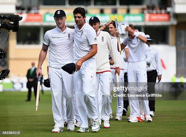 Alastair Cook of England congratulates Ben Stokes as they leave the field after winning the Ashes during day three of the 4th Investec Ashes Test...