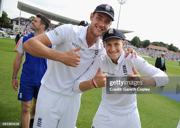 Stuart Broad and Joe Root of England celebrate after winning the 4th Investec Ashes Test match between England and Australia at Trent Bridge on...