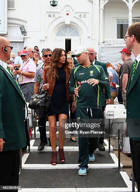Michael Clarke of Australia and Kyly Clarke, wife of Michael Clarke of Australia, walk onto the field after Clarke announced his retirement during...