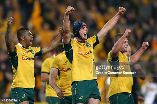 Kurtley Beale, Dean Mumm and James Slipper of the Wallabies celebrate winning the Rugby Championship match between the Australia Wallabies and the...