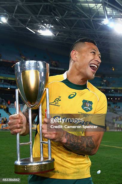 Israel Folau of the Wallabies poses with the Rugby Championship Trophy after winning the Rugby Championship match between the Australia Wallabies and...