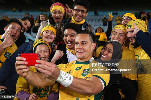 Matt Toomua of the Wallabies poses with fans after winning the Rugby Championship match between the Australia Wallabies and the New Zealand All...