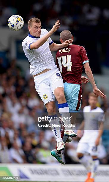 Chris Wood of Leeds United challenges David Jones of Burnley during the Sky Bet Championship match between Leeds United and Burnley at Elland Road on...