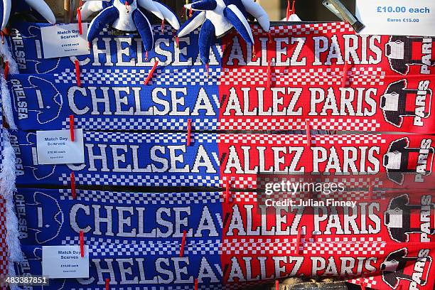 Matchday flags scarves are sold on a street stall ahead of the UEFA Champions League Quarter Final second leg match between Chelsea and Paris...