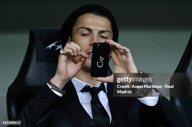 Cristiano Ronaldo of Real Madrid takes a picture with his mobile phone prior of the UEFA Champions League Quarter Final second leg match between...