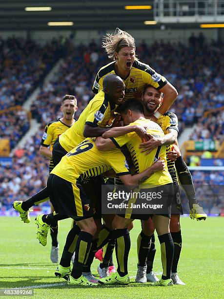 Miguel Layun of Watford celebrates scoring his team's first goal with his team mates during the Barclays Premier League match between Everton and...