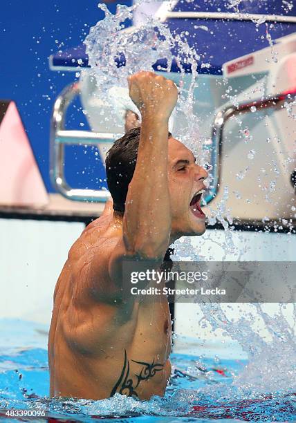 Florent Manaudou of France celebrates winning the gold medal in the Men's 50m Freestyle Final on day fifteen of the 16th FINA World Championships at...