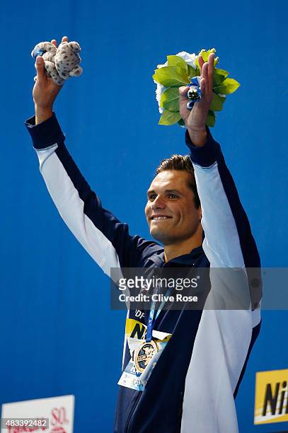 Gold medallist Florent Manaudou of France celebrates during the medal ceremony for the Men's 50m Freestyle Final on day fifteen of the 16th FINA...