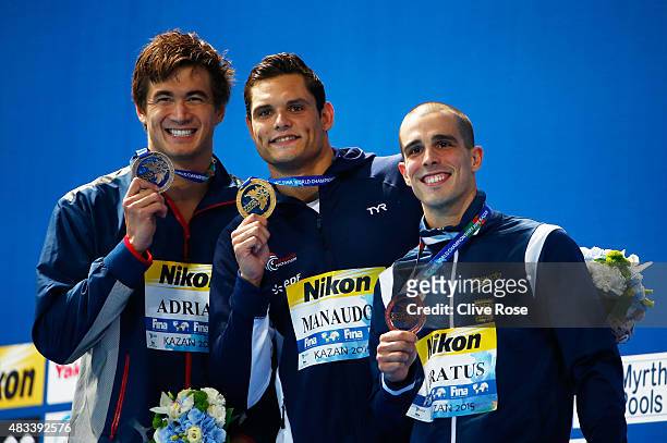 Gold medallist Florent Manaudou of France poses with silver medallist Nathan Adrian of the United States and bronze medallist Bruno Fratus of Brazil...