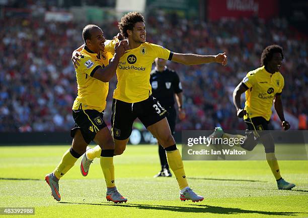 Rudy Gestede of Aston Villa celebrates scoring his team's first goal with his team mates Gabriel Agbonlahor and Carlos Sanchez during the Barclays...