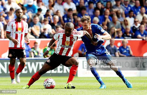 Andy King of Leicester City in action with Jermain Defoe of Sunderland during the Barclays Premier League match between Leicester City and Sunderland...