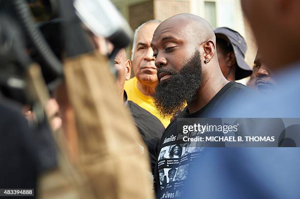 Michael Brown, Sr. Father of slain 18 -year old Michael Brown Jr. Speaks to the media prior to a march of solidarity in Canfield Apartments on August...