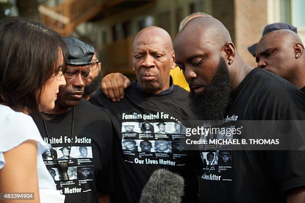Michael Brown, Sr. Father of slain 18 -year old Michael Brown Jr. Speaks to the media prior to a march of solidarity at Canfield Apartments on August...