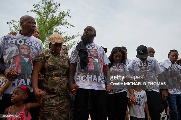 Michael Brown Sr., father of slain 18 year-old Michael Brown Jr. Holds hands along with Brown family members prior to a march of solidarity at...