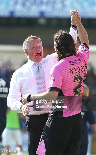Northampton Town manager Chris Wilder celebrates with goalscorer John-Joe O'Toole of Northampton at the final whistle during the Sky Bet League Two...
