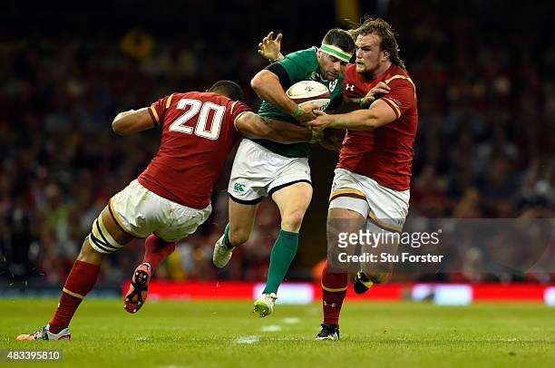 Wales player Kristian Dacey and Toby Faletau tackle Ireland player Fergus McFadden during the Rugby World Cup warm up match between Wales and Ireland...