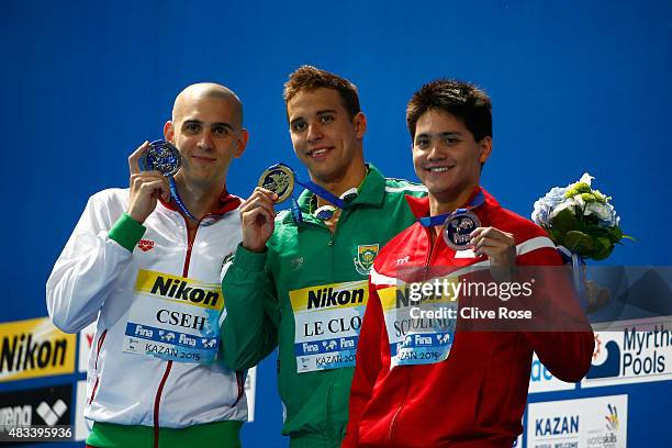 Gold medallist Chad Le Clos of South Africa poses with silver medallist Laszlo Cseh of Hungary and bronze medallist Joseph Isaac Schooling during the...