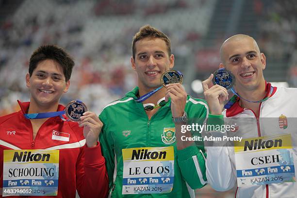 Gold medallist Chad Le Clos of South Africa poses with silver medallist Laszlo Cseh of Hungary and bronze medallist Joseph Isaac Schooling during the...