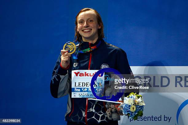 Gold medallist Katie Ledecky of the United States poses during the medal ceremony after setting a new world record of 8:07.39 in the Women's 800m...