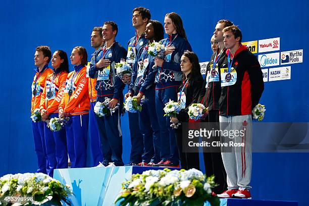 Gold medallists Ryan Lochte, Nathan Adrian, Simone Manuel and Missy Franklin of the United States pose with silver medallists Ranomi Kromowidjojo,...