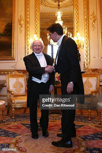 Leader of the Labour Party Ed Miliband greets the President of Ireland Michael D. Higgins ahead of a State Banquet on April 8, 2014 in Windsor,...