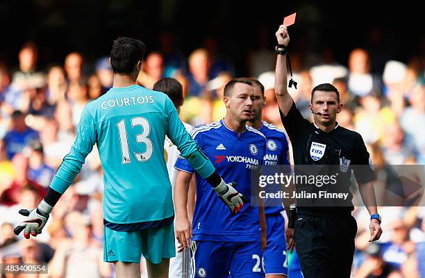 Thibaut Courtois of Chelsea is shown the red card by referee Michael Oliver during the Barclays Premier League match between Chelsea and Swansea City...