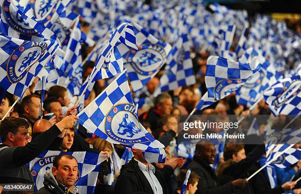 Chelsea fans wave flags during the UEFA Champions League Quarter Final second leg match between Chelsea and Paris Saint-Germain FC at Stamford Bridge...