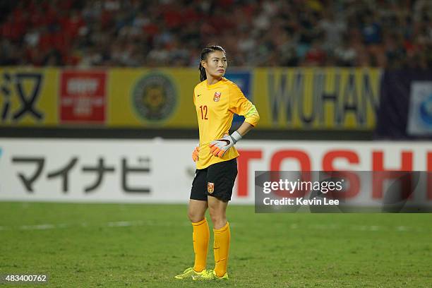 Wang Fei of China PR looks dejected after she fails to stop a goal at EAFF East Asian Cup 2015 final round against Japan at the Wuhan Sports Center...