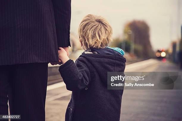 father and son waiting for a train - family from behind stock pictures, royalty-free photos & images