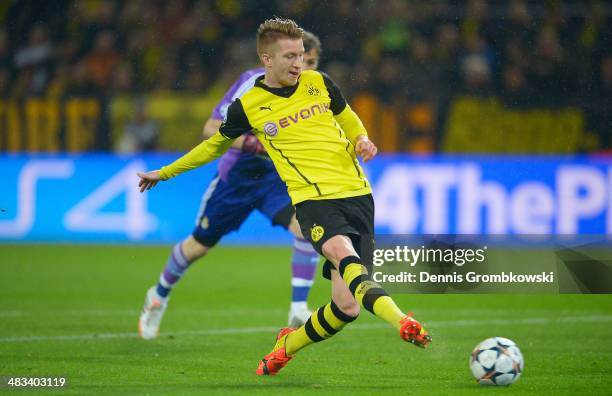 Marco Reus of Borussia Dortmund scores the opening goal during the UEFA Champions League Quarter Final second leg match between Borussia Dortmund and...