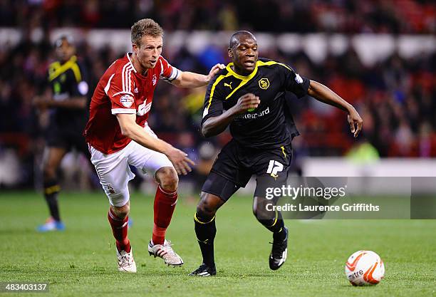 Jeremy Helan of Sheffield Wednesday battles with Danny Collins of Nottingham Forest during the Sky Bet Championship match between Nottingham Forest...