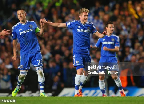 John Terry of Chelsea congratulates Andre Schurrle of Chelsea on scoring their first goal during the UEFA Champions League Quarter Final second leg...