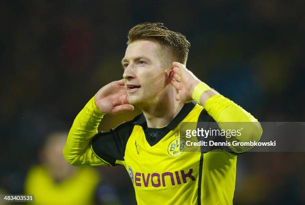 Marco Reus of Borussia Dortmund gestures after scoring his second goal during the UEFA Champions League Quarter Final second leg match between...