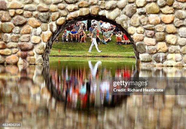 Kevin Na walks to the third green during the third round of the World Golf Championships - Bridgestone Invitational at Firestone Country Club South...