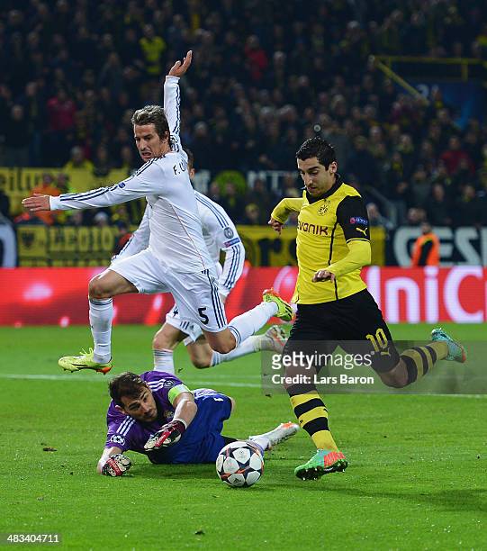 Henrikh Mkhitaryan of Borussia Dortmund misses a chance at goal as Iker Casillas and Fabio Coentrao of Real Madrid look on during the UEFA Champions...