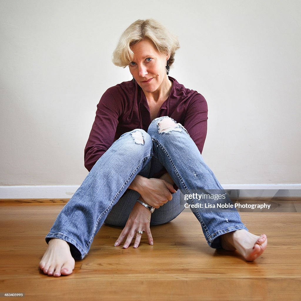 Woman sitting on floor