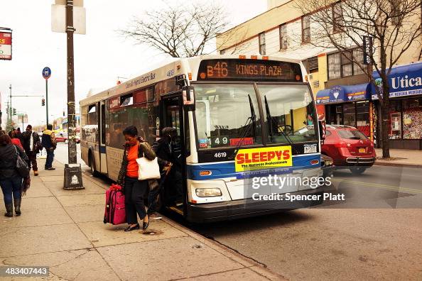 Passengers get off of the B46 bus on April 8, 2014 in the Brooklyn
