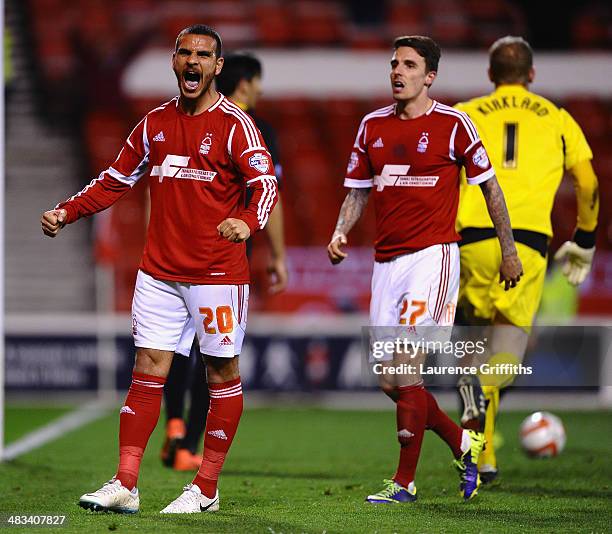 Marcus Tudgay of Nottingham Forest celebrates scoring the second goal in front of Matt Derbyshire during the Sky Bet Championship match between...