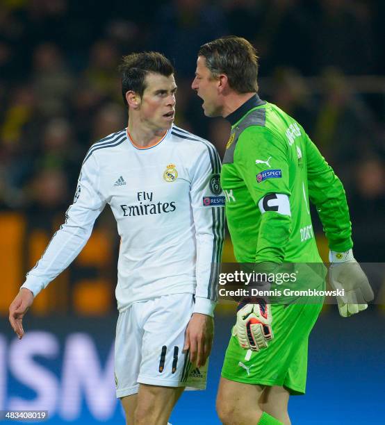 Gareth Bale of Real Madrid exchanges words with goalkeeper Roman Weidenfeller of Borussia Dortmund during the UEFA Champions League Quarter Final...