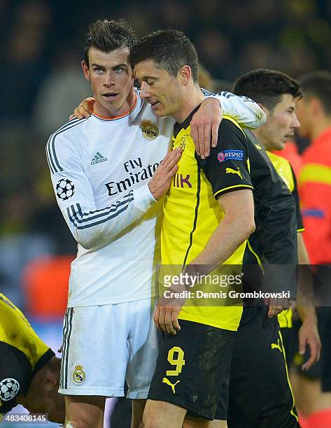Gareth Bale of Real Madrid consoles Robert Lewandowski of Borussia Dortmund after the UEFA Champions League Quarter Final second leg match between...