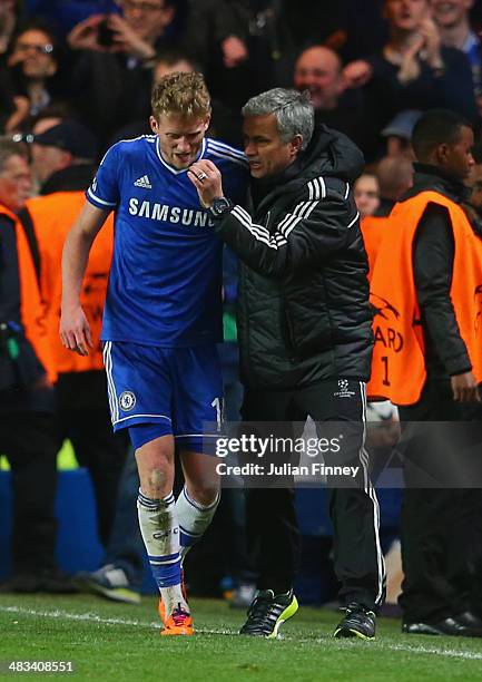 Jose Mourinho manager of Chelsea speaks to Andre Schurrle of Chelsea after their second goal during the UEFA Champions League Quarter Final second...