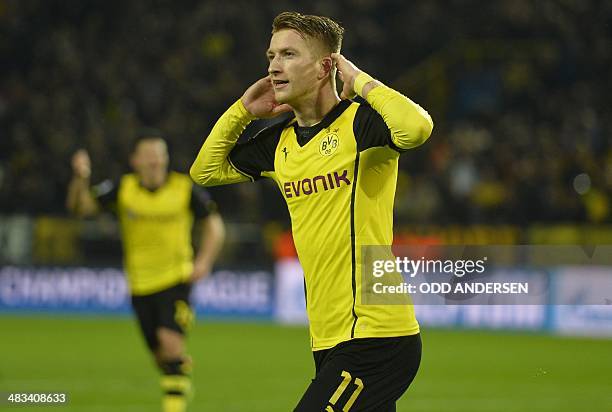 Dortmund's striker Marco Reus celebrates scoring during the UEFA Champions League quarter-final, second leg football match Borussia Dortmund vs Real...