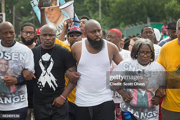 Michael Brown Sr. Leads a march from the location where his son Michael Brown Jr. Was shot and killed to Normandy High School where his son was a...